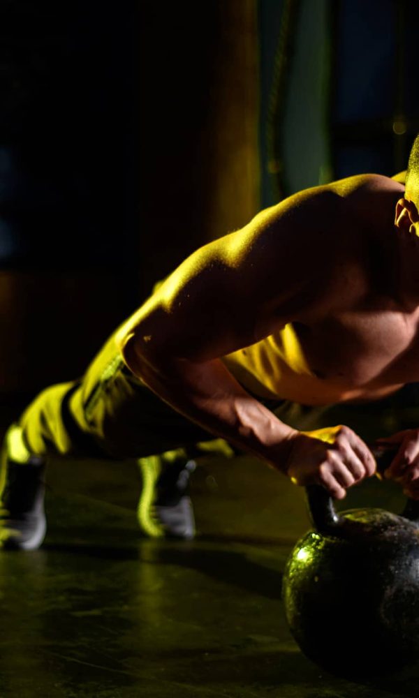 man-doing-pushups-in-the-gym-JVWYDWS.jpg